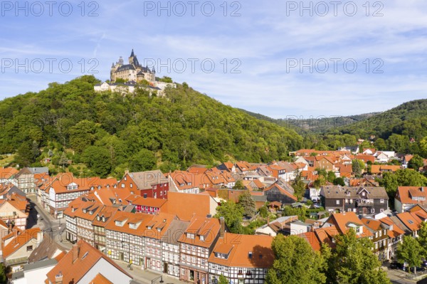 Aerial view of the district Nöschenrode with castle, in the foreground half-timbered houses Schöne Ecke, Wernigerode, Harz, Saxony-Anhalt, Germany