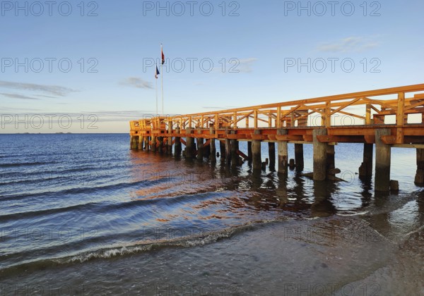 New south beach bridge at atmospheric sunrise with a view of Amrum, Südstrand, Wyk auf Föhr, North Frisia, Germany