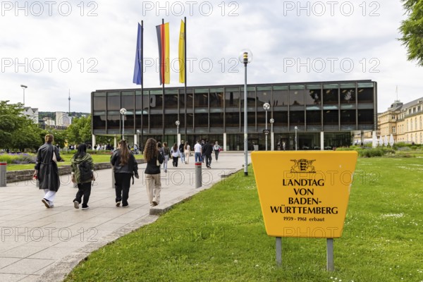 House of the state parliament of Baden-Württemberg, state parliament building in Stuttgart. Flags above the building on a session day. The Haus des Landtags was built between 1959 and 1961 according to a design by Kurt Viertel. From 2013 to 2016, the listed building was completely renovated and brought up to technical standards. Stuttgart, Baden-Württemberg, Germany