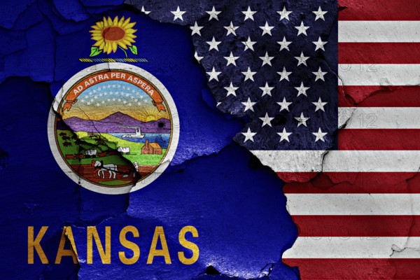 Flags of Kansas and USA painted on cracked wall