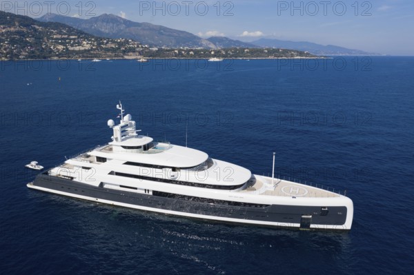 Aerial view 88, 5 metre motor yacht ILLUSION PLUS, delivered in 2018 by the Pride Mega Yachts shipyard, off the Principality of Monaco, French Riviera, Mediterranean Sea