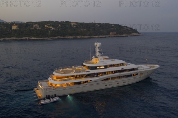 74 metre long motor yacht GLOBAL (ex Kismet), built by the Bremen shipyard Lürssen Yachts, owned for a long time by the German entrepreneur Lars Windhorst, today's owner Askar Alshinbayev from Kazakhstan, here at anchor off the Principality of Monaco, behind Roquebrune Cap Martin, French Riviera, France, Mediterranean Sea