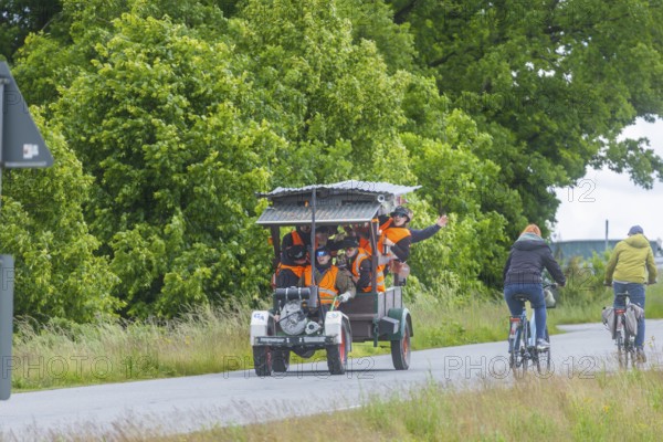 Ascension Day. Groups of men are on the road around Moritzburg, Moritzburg, Saxony, Germany, sometimes with very fantastic companions and always with enough beer