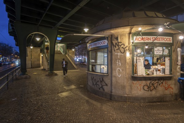 Germany, Berlin, 03.12.2024, snack bar, Korean street food, under the underground viaduct (Magistratsschirm), Schönhauser Allee, underground exit