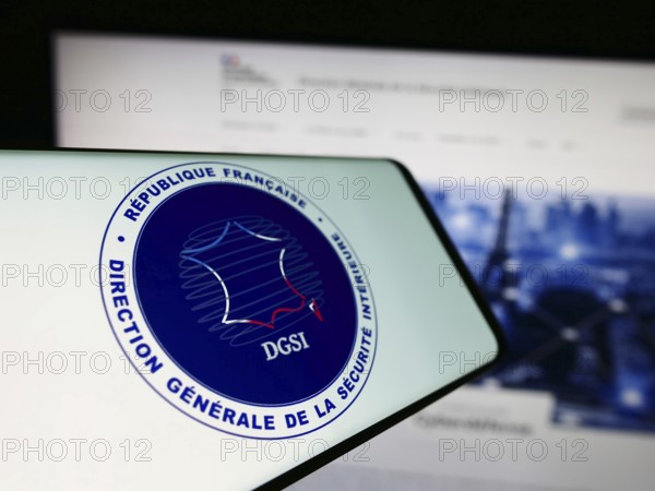 Stuttgart, Germany, 11-27-2023: Smartphone with logo of Direction Générale de la Sécurité Intérieure (DGSI) in front of website. Focus on center-left of phone display
