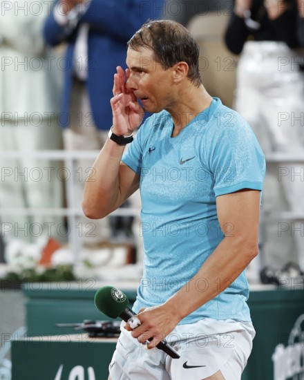 Emotional Rafael Nadal iholding speech after his early loss at the French Open, Roland Garros, Paris, France.