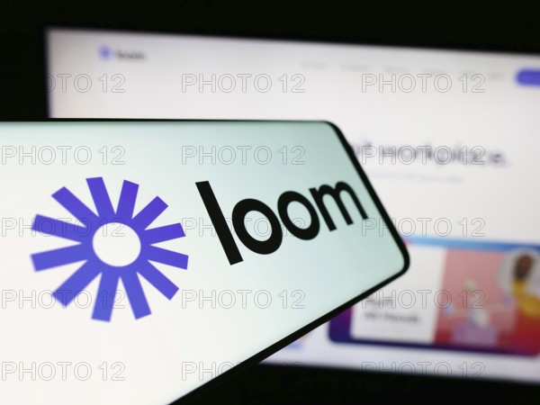 Stuttgart, Germany, 12-29-2023: Smartphone with logo of American video communication software company Loom Inc. in front of business website. Focus on center of phone display