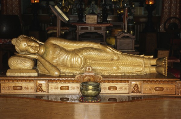 Nirvana, sleeping Buddha sandal wood statue in Horinji Japanese temple, Sarnath, Uttar Pradesh, India