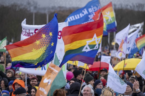 Germany, Berlin, 3 February 2024, Protest against the rise of right-wing extremism, called by the alliance Hand in Hand, Jetzt solidarisch aktiv werden! . Following a rally on the lawn in front of the Reichstag building, rainbow flag, Star of David
