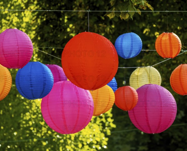Party with colourful lampions hanging in the garden