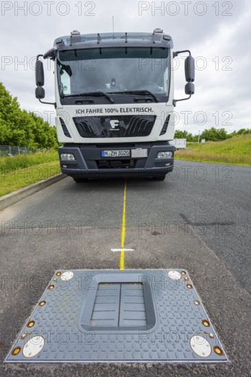 Charging electric vehicles without cables at the Fraunhofer IVI. A new automatic charging system for electric commercial vehicles developed at the institute does not require a charging station and offers greater safety. The driver can start the entire recharging procedure at the simple press of a button - without having to leave the vehicle. This patented charging system will be trialled over the next few months in cooperation with Dresdner Stadtreinigung (SRD) in the daily operation of an electric truck, Dresden, Saxony, Germany