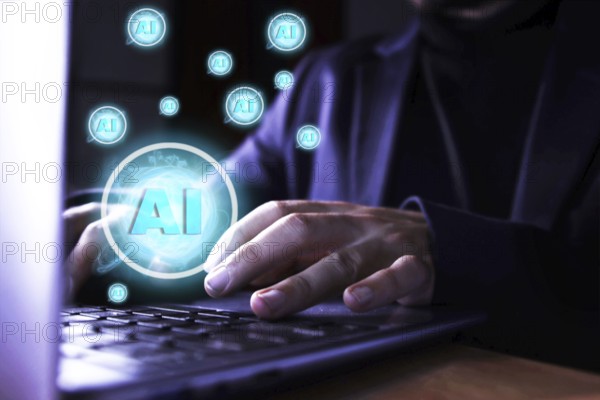 Close up of a man using a computer with artificial intelligence icons. use of artificial intelligence