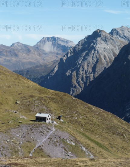 Ramozhütte SAC, Davos mountains in the back with Weissfluh peak, drone shot, Welschtobel, Arosa, Grisons, Switzerland