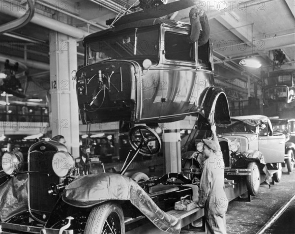 Ford history. It's factory in Highland park Michigan USA was a production facility for the Model T car and has become known for being the first factory in history to assemble cars on a moving assembly line. In 1927 the new model A was in production and the picture taken that year shows the assembly line with bodies and chassis being assembled by factory workers
