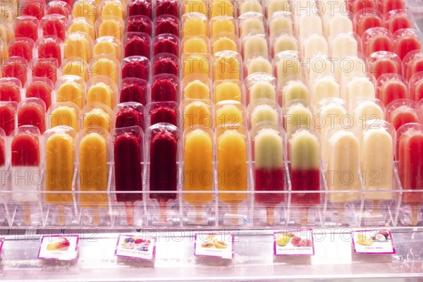 Several rows of ice lollies, Mercat de la Boqueria, famous market on the Ramblas in Barcelona, Spain