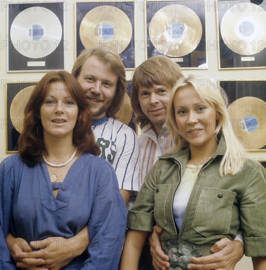 ABBA. Anni-Frid Lyngstad, Benny Andersson, Agnetha Fältskog and Björn Ulvaeus in the 1970s in front of a wall full of gold records for record selling albums on Polar record company. 1976 Björn Ulvaeus Benny Andersson Anni-Frid Lyngstad Agnetha Fältskog