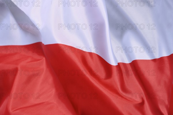 Close-up of the flag of Poland waving in the wind with wave pattern