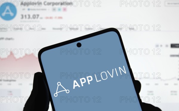App lovin logo is displayed on smartphone. AppLovin Corporation is an American mobile technology company