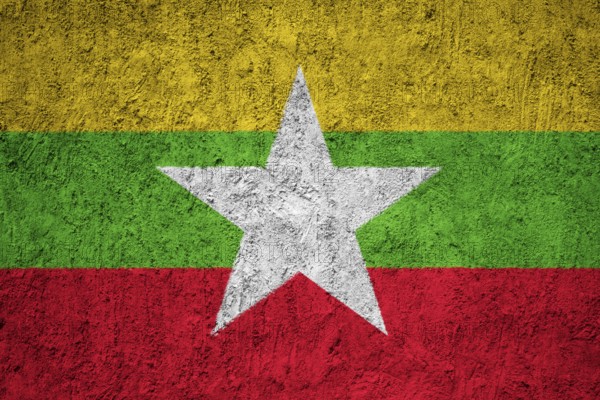 Myanmar flag painted on the cracked grunge concrete wall