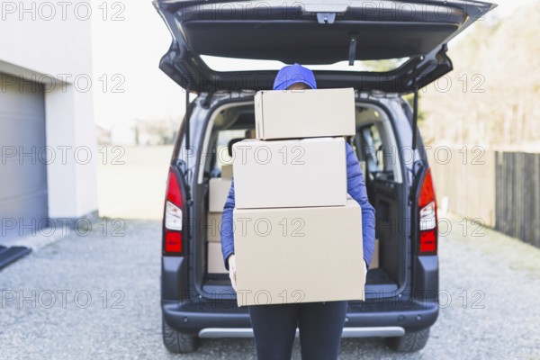 Anonymous courier with plenty boxes. Resolution and high quality beautiful photo