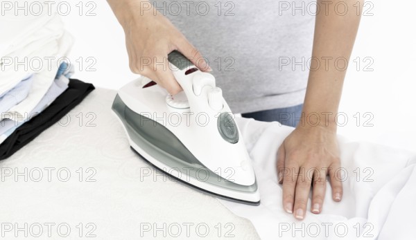 Unrecognisable lady ironing clothes. Resolution and high quality beautiful photo