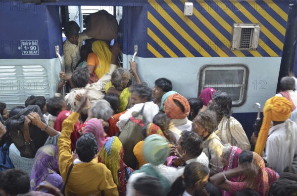 Peoples trying to board in coach of train at Jodhpur Rajasthan India Asia
