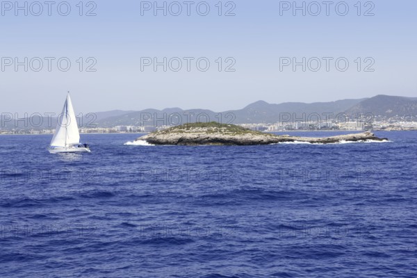 Ibiza mediterranean island blue seascape with rocks