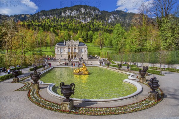 Water parterre with flora fountain and the portal of Linderhof Castle in spring, municipality of Ettal, Ammergau Alps, Ammertal, Upper Bavaria, Bavaria, Germany