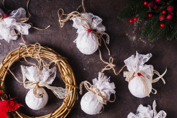 Retro textile Christmas baubles with white lace and rope