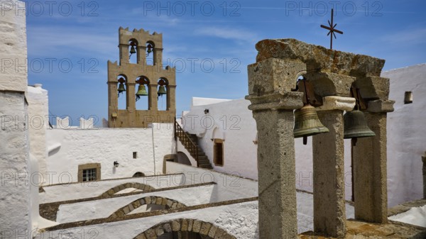 Historic architecture with bell tower under a blue sky, St John's Monastery, Ancient columned section, Agiou Theologou Monastery, Monastery of St John the Theologian, World Heritage Site 1999, Patmos, Dodecanese, Greek Islands, Greece