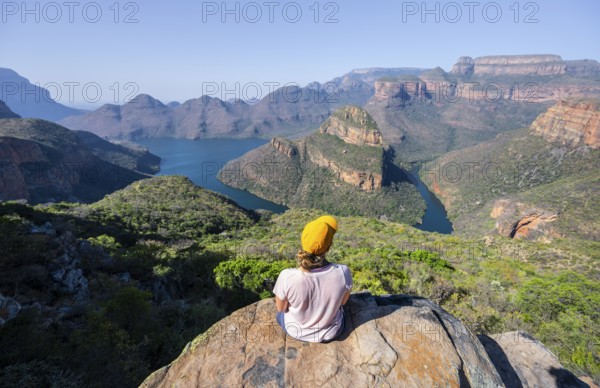 Hiker enjoying panorama, Blyde River Canyon with summit Three Rondawels, view of canyon with river Blyde River and table mountains, canyon landscape, Panorama Route, Mpumalanga, South Africa