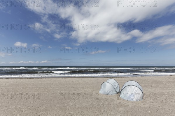 Lonely beach with two silver beach shells on the Baltic Sea, blue sky, Kühlungsborn, Mecklenburg-Vorpommern, Germany
