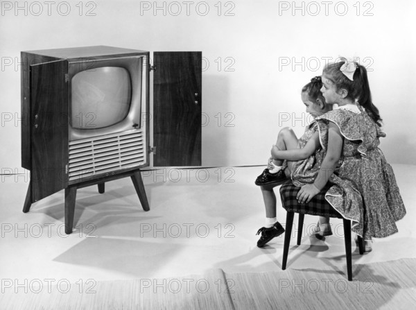 Living room, Television, Sisters, Girls, 1960s, Two little girls sitting in front of an old television in a vintage room, Historical photo