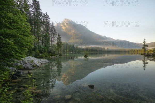 Magical sunrise with fog at Hintersee near Ramsau in Berchtesgadener Land
