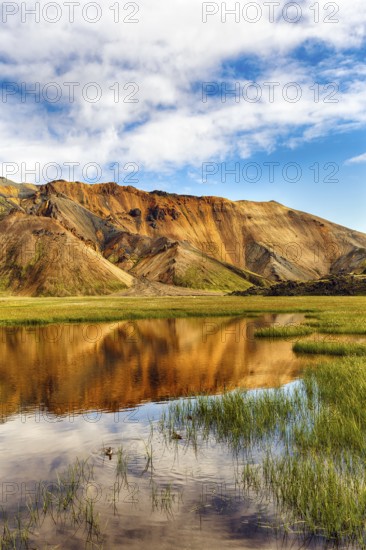 Volcanic landscape, colourful rhyolite mountains, water, Landmannalaugar, remote hiking area in Fjallabak nature reserve, Laugavegur hiking trail, Suðurland, Sudurland, Icelandic highlands, Iceland