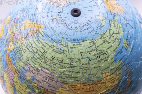 Puzzle globe. Map made from puzzle pieces. Russia