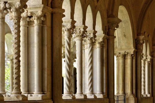 Slender Gothic columns, double columns with filigree capitals in the cloister, Gothic basilica of the Cistercian Abbey of Fossanova, Cistercian-Burgundian architectural style, Priverno, Province of Latina, Lazio, Italy