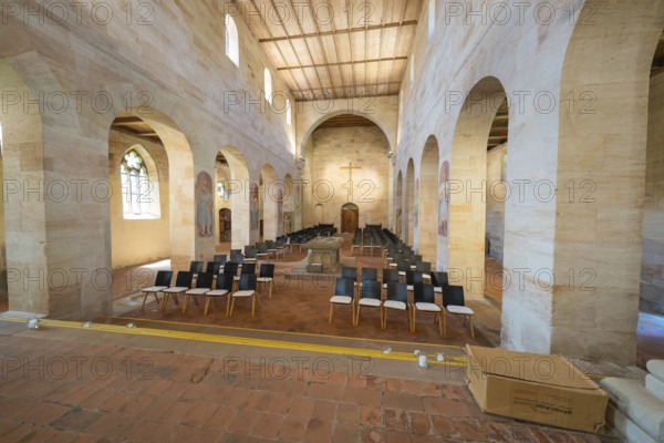 Church interior with pews and cross under bright daylight, event and wedding location Lorch Monastery, Lorch, Germany