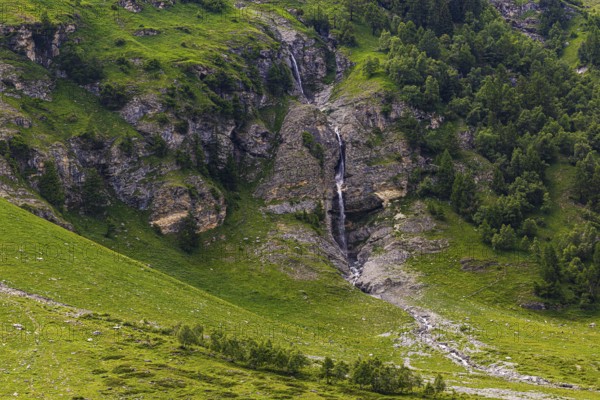 Waterfall cascading down a rock face, Zinal Valley, Val d'Anniviers, Valais Alps, Canton Valais, Switzerland