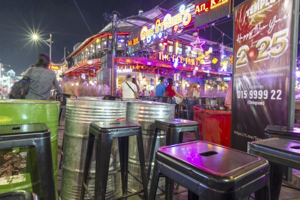Neon lights, the legendary restaurant THE RED PIANO, Pub Street in the evening, entertainment district with bars and restaurants, Siem Reap, Cambodia