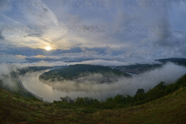 River landscape in a bend with misty hills and cloudy sky illuminated by the sunrise, summer, Rhine bend Boppard, Gedeonseck, Boppard, Rhine, Rhine-Hunsrück district, Rhineland-Palatinate, Germany