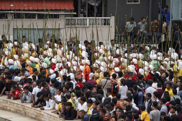 JOWAI, INDIA - JULY 14: People from the Pnar community attend the Behdienkhlam festival in Jowai, India on July 14, 2025. Behdienkhlam is a vibrant annual festival celebrated by the Pnar (Jaintia) community of Meghalaya, especially in Jowai, to drive away plague and diseases and to pray for a good harvest. Observed in July after the sowing season, it features traditional rituals, offerings to ancestral spirits, and the grand procession of beautifully decorated bamboo structures called rots, which are later immersed in a sacred muddy pool known as Ka Aitnar