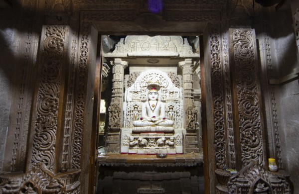White marble statue of Mahavira in the Jain temple Chandraprabhu in the fortress in Jaisalmer, Rajasthan, India