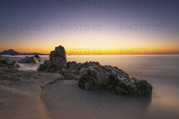 The sun rises on the Costa Rei, a stretch of coastline on the Italian Mediterranean island of Sardinia, Monte Nai, Costa Rei, Sardinia, Italy