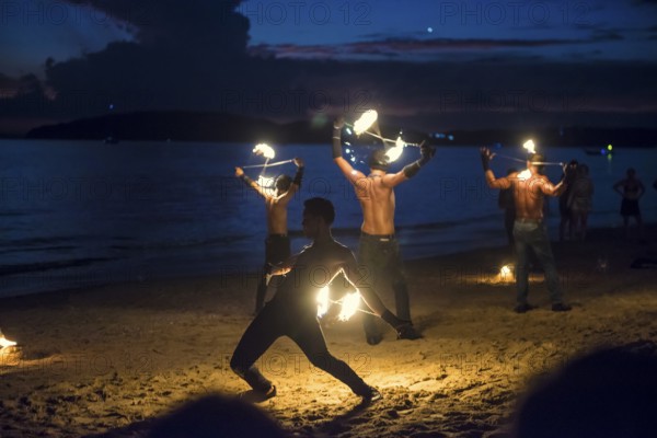 Fire show, jugglers with fire, Ao Nang Beach, sunset, Ao Nang, Krabi, Thailand