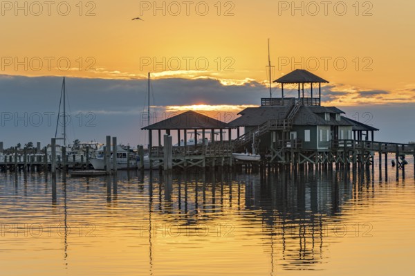Biloxi Schooner Pier Complex at sunset on the Gulf of Mexico at Biloxi, Mississippi, USA