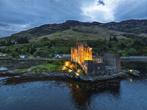 Night over Eilean Donan Castle and Loch Duich from a drone, Isle of Skye, Highlands, Scotland, England, United Kingdom