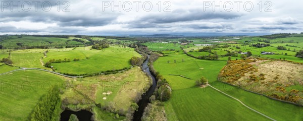 Panorama of Farms over Ullswater Lake from drone, Pooley Bridge, Lake District National Park, Cumbria, England, United Kingdom