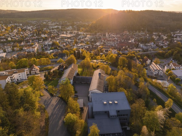 Panoramic view of the city at sunset with many trees and buildings, Nagold, Black Forest, Germany