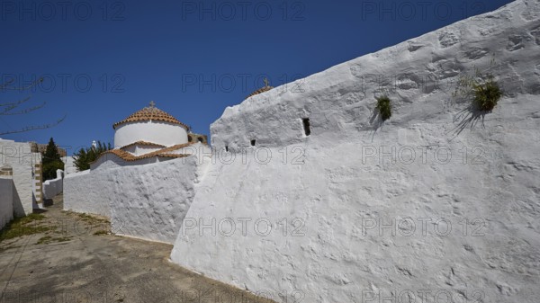 Church of Agia Kioura, White monastery wall under a blue sky, simple and traditional, Church, Chora, World Heritage Site 1999, Patmos, Dodecanese, Greek Islands, Greece